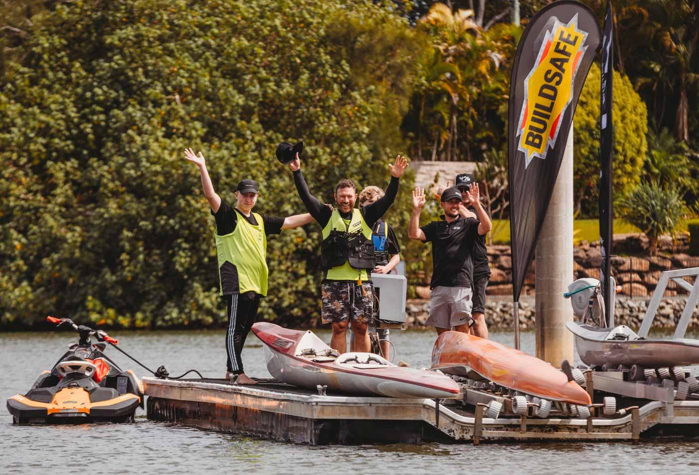 A group of people waving in the distance