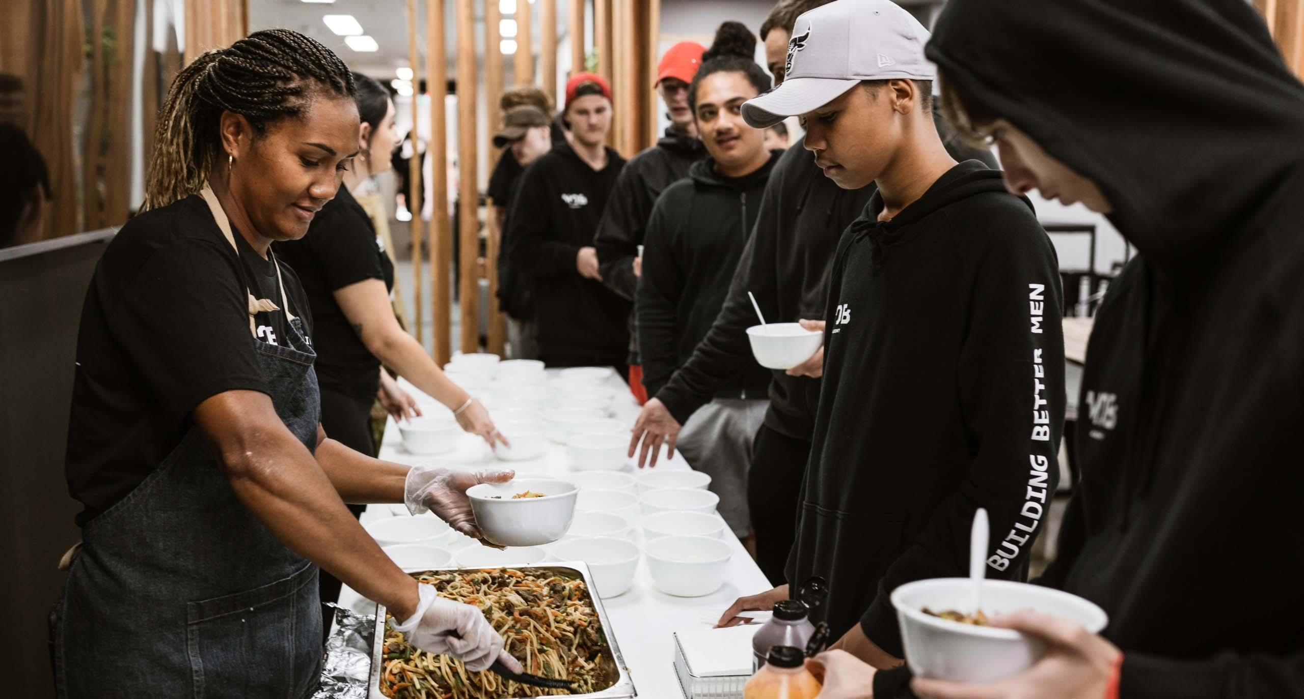 Men of Business Academy students eating lunch